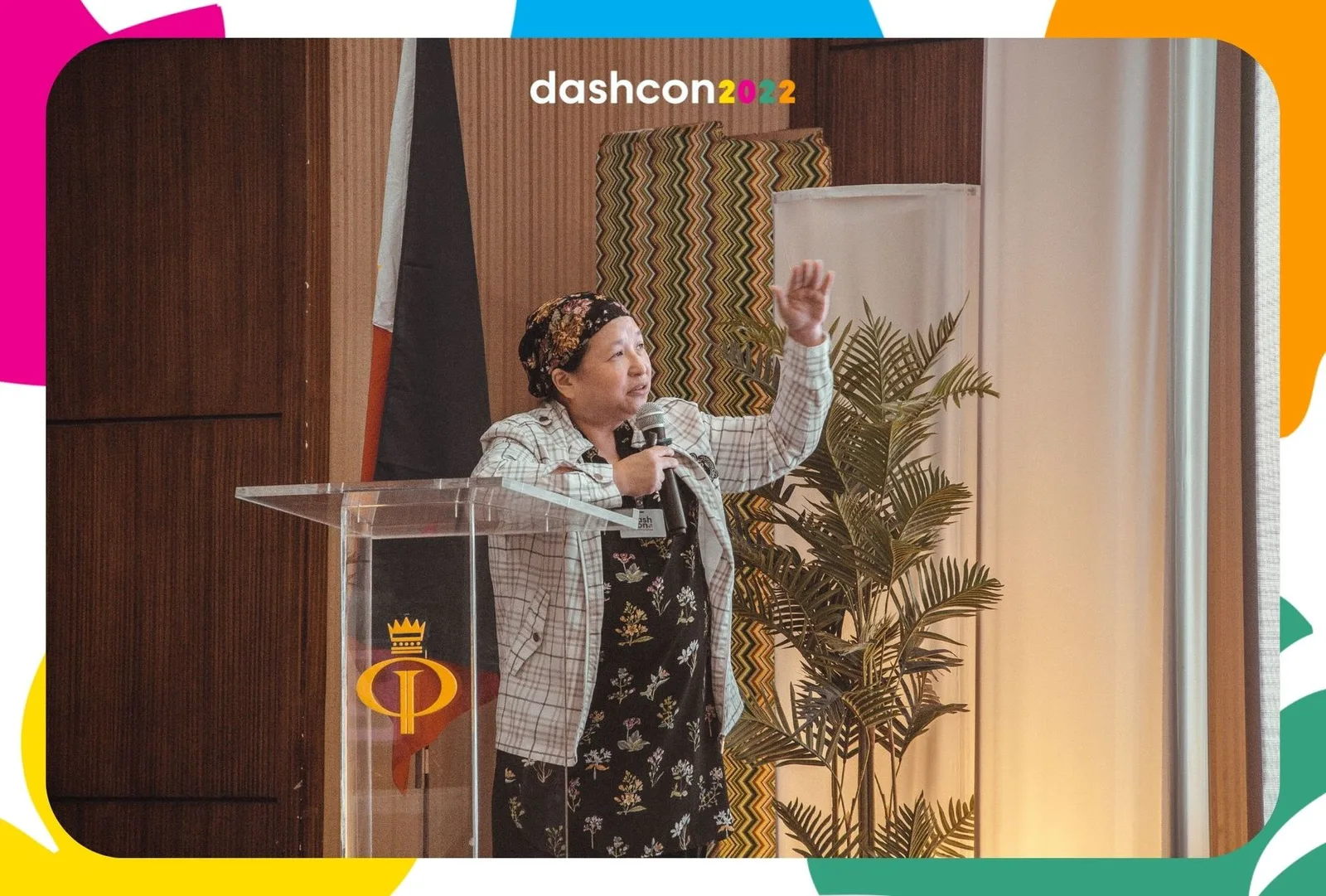 Janette Toral speaking at a podium at DashCon 2022